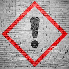 Avoid getting scammed by home remodeling contractor sign pained on brick wall